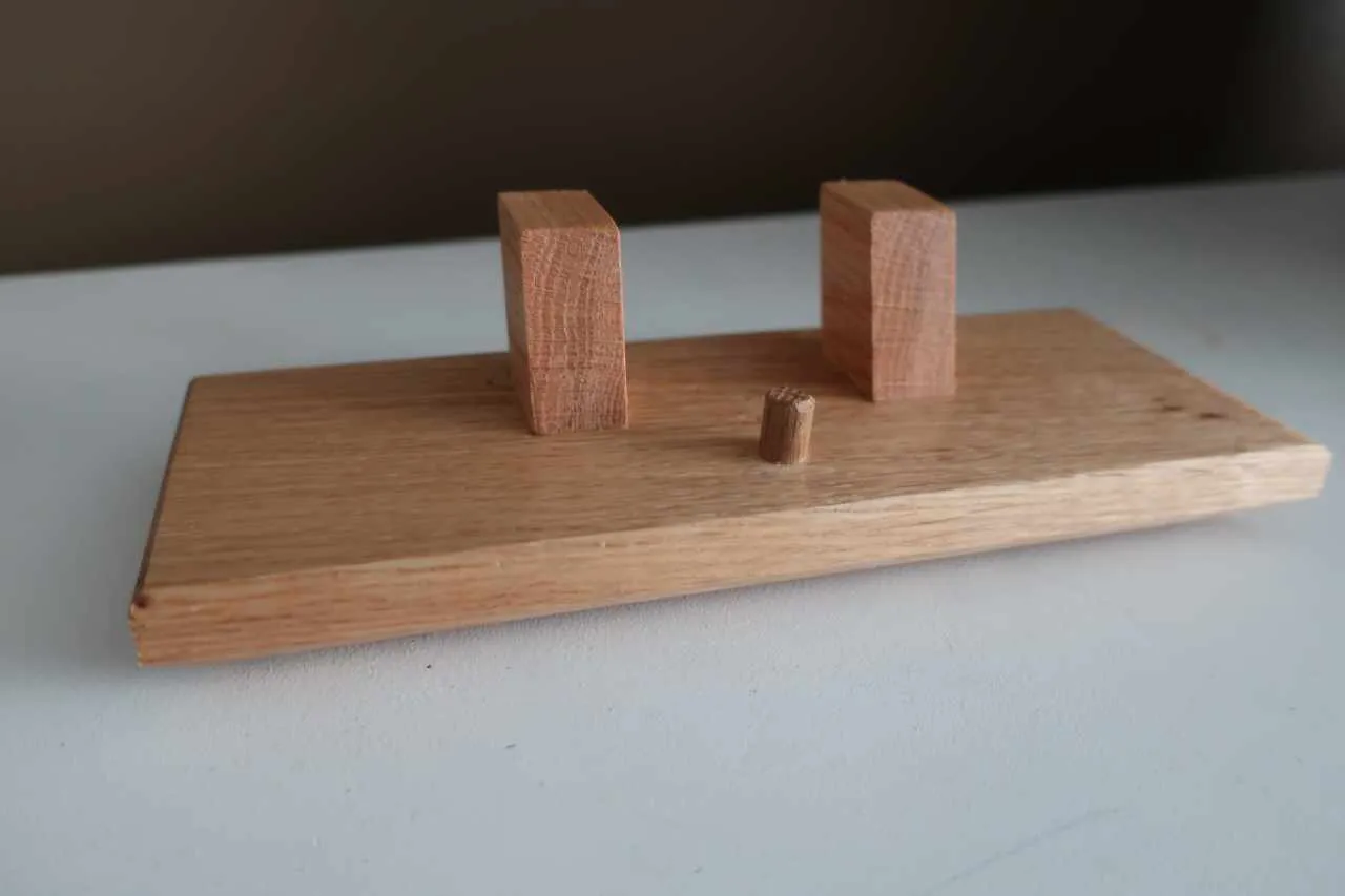 Added the dowel, a couple coats of spray lacquer, and some rubber feet